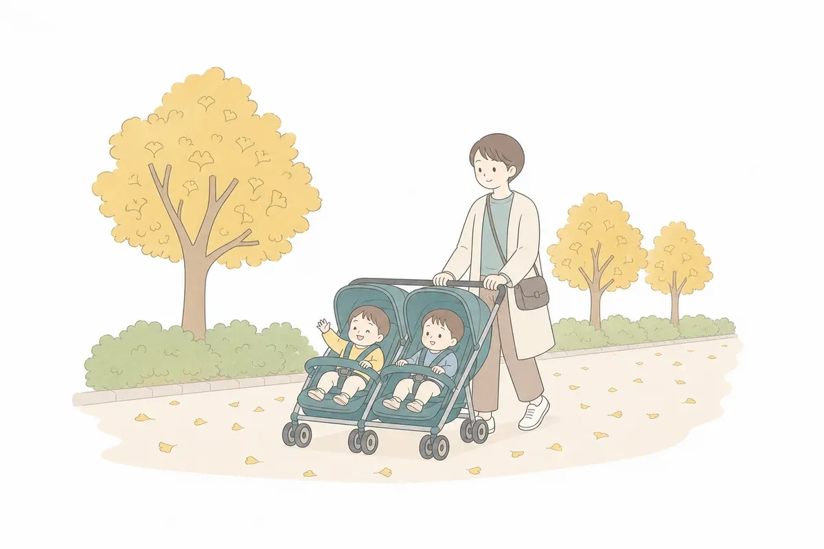 紅葉したイチョウ並木の平坦な道を双子用ベビーカーで散歩する親子のイラスト